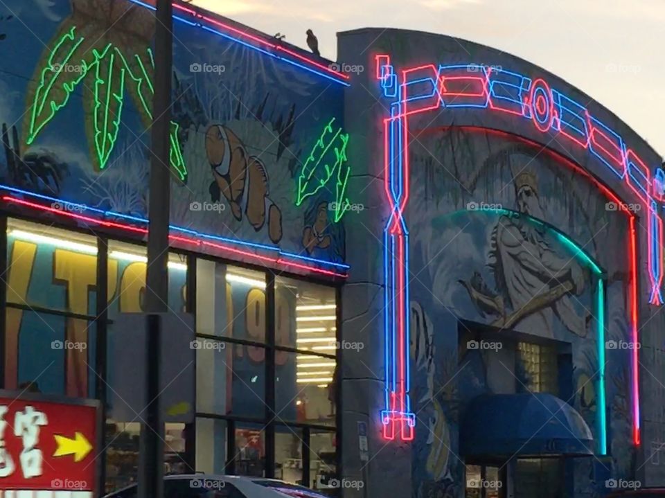 Gift shop with Poseidon painted on front 