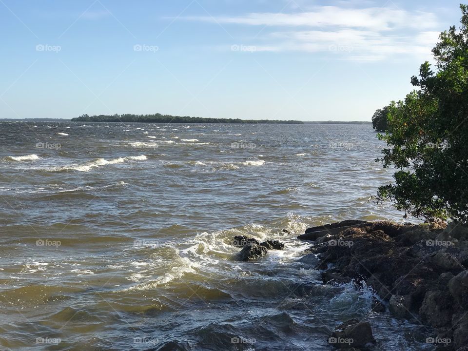 Waves crashing on the rocky shore.