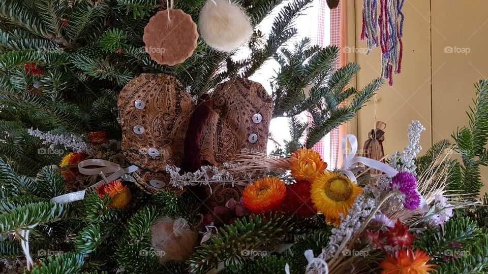 Christmas tree decorated with homemade antique ornaments