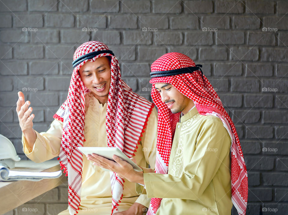 Middle eastern man using tablet