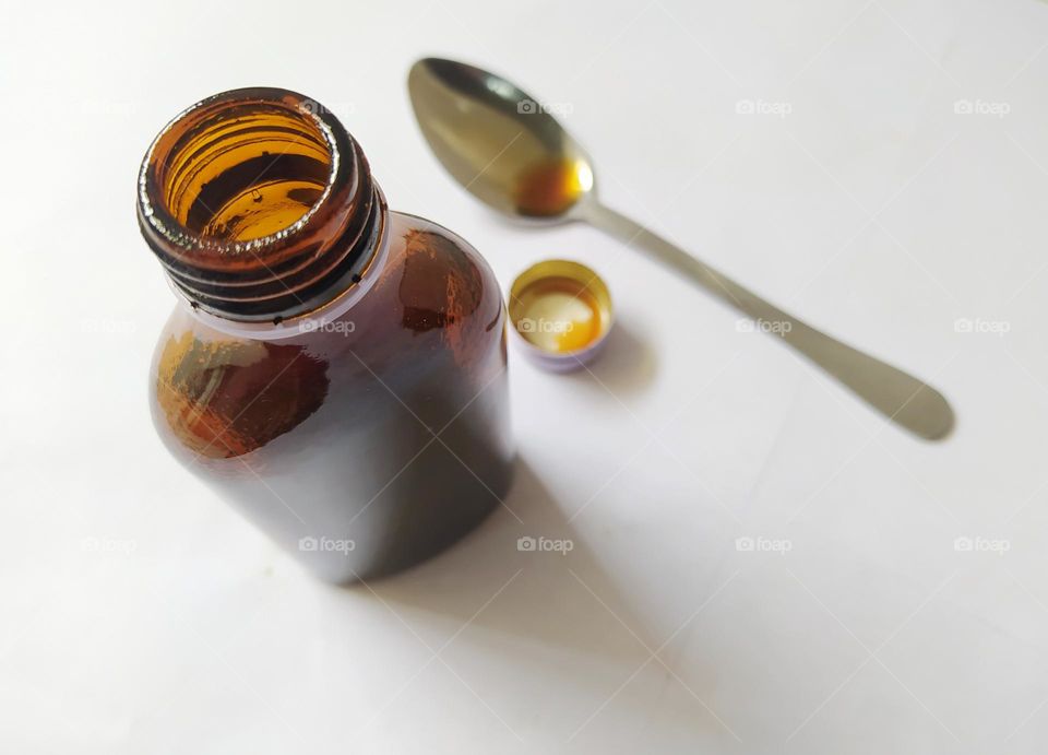 Finished pouring liquid cough medicine into a tablespoon