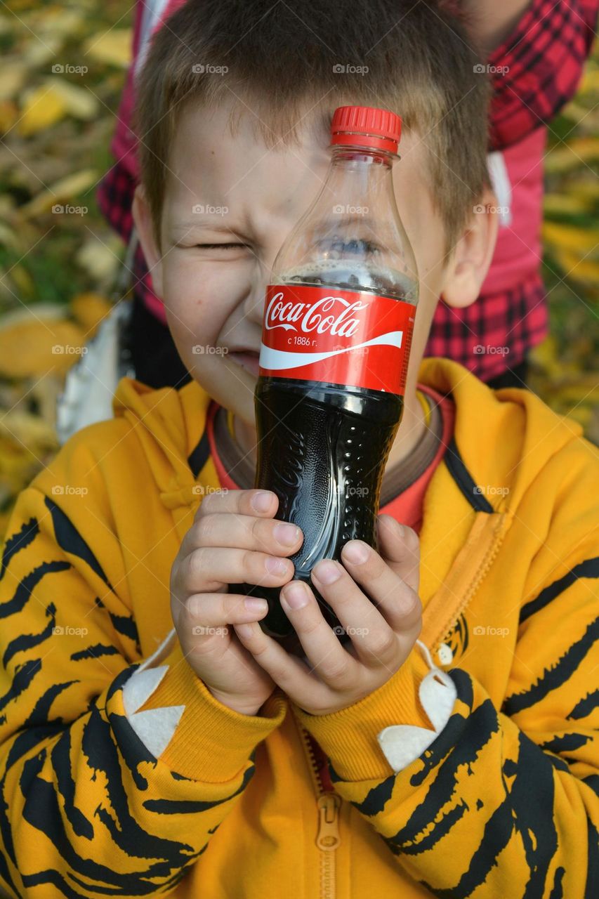 child boy with coca cola emotions