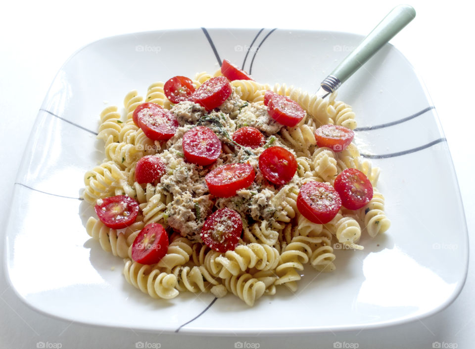 shot of a plate of salmon pasta salad.