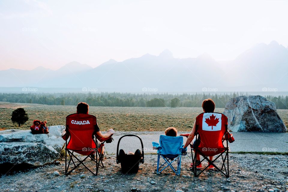 family awaiting sunset and the plateau in glacier country