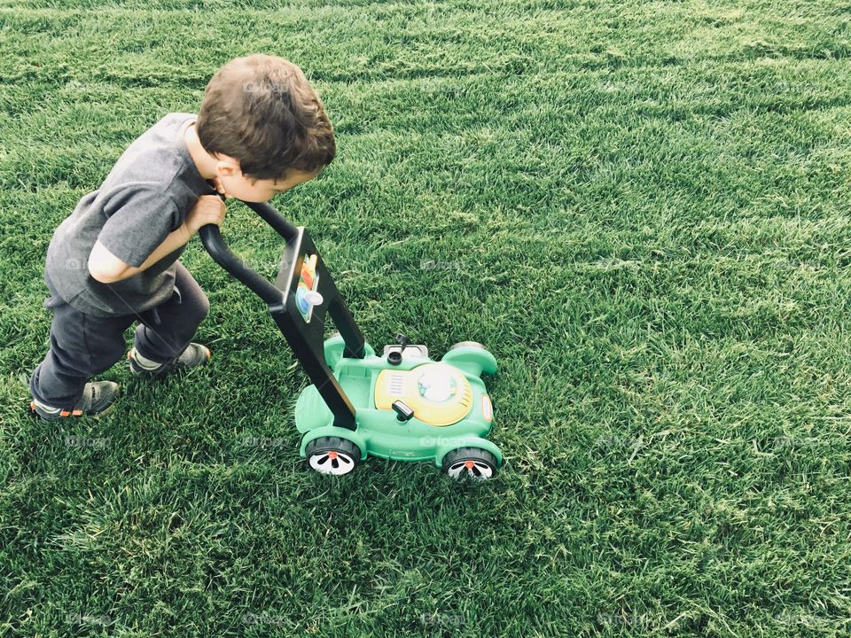 Helping to cut the grass