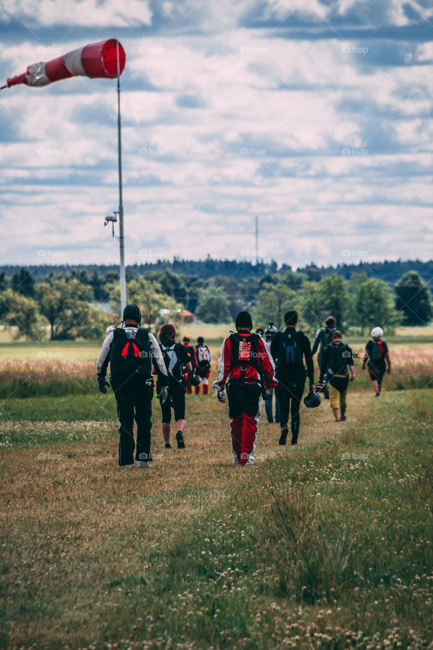 Skydivers walking to the plane. 