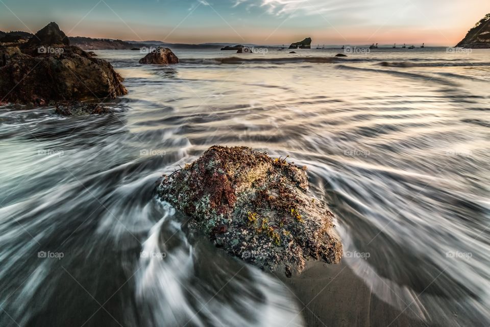 Surf at rocky beach