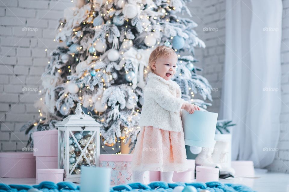 Little girl and Christmas gift 