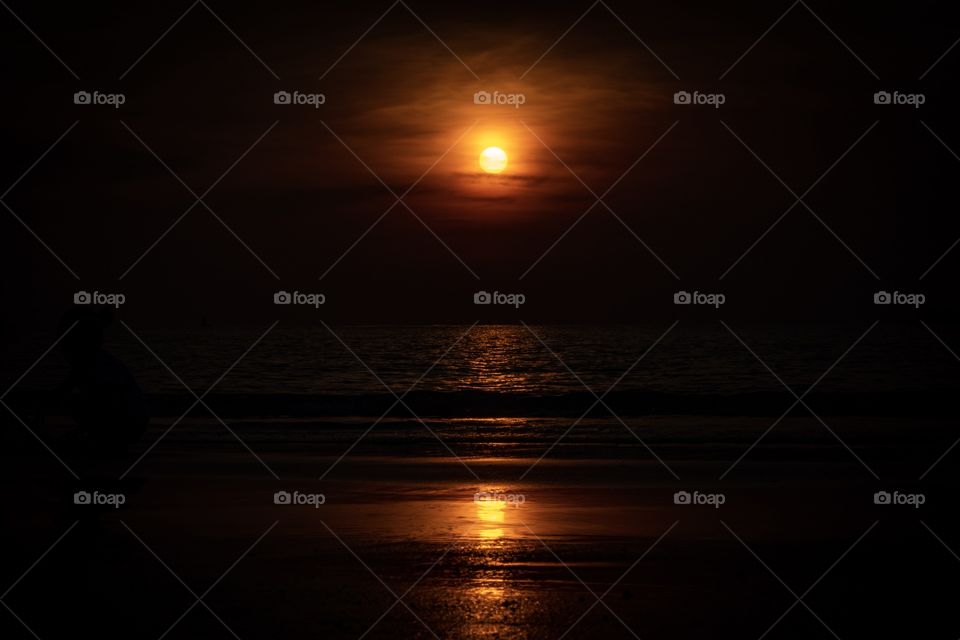 Sunset beautiful reflection on sea and beach