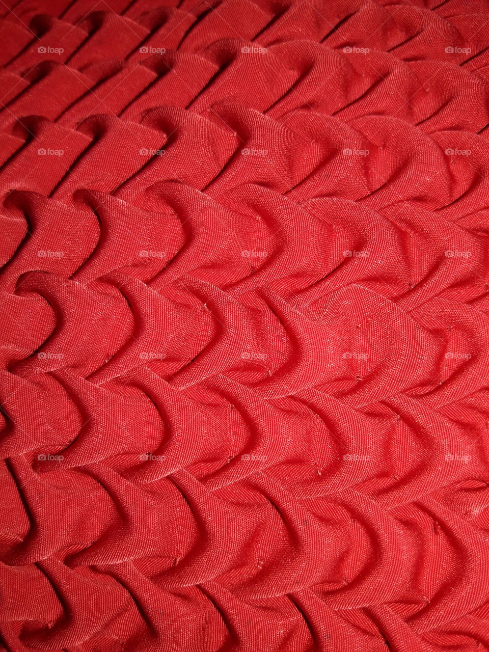 cloth material designer stiches wave fall red close-up texture
