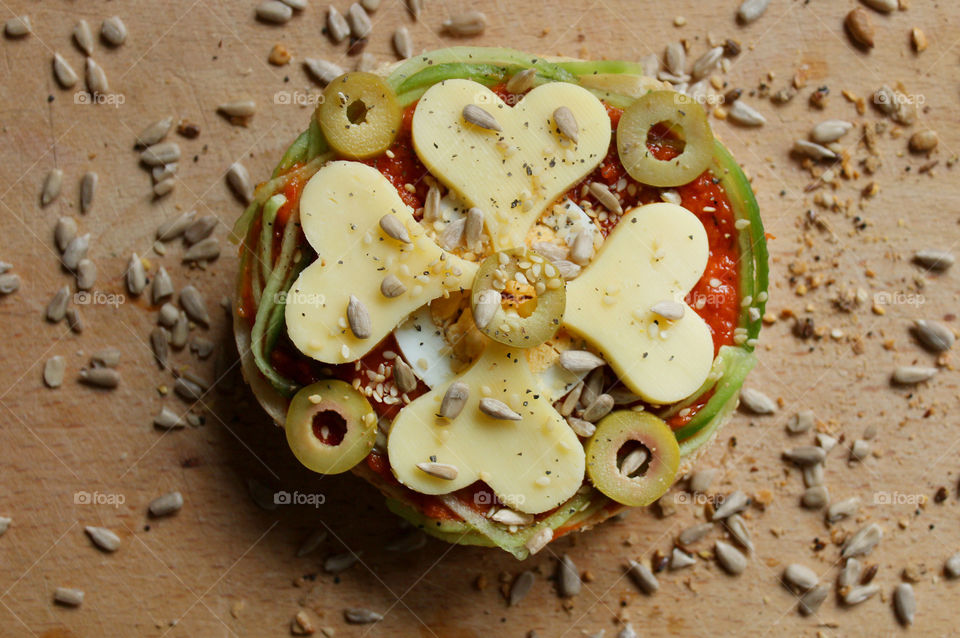 Love sandwich, heart shaped yellow cheese, tomato sauce, olives, egg and seeds 2