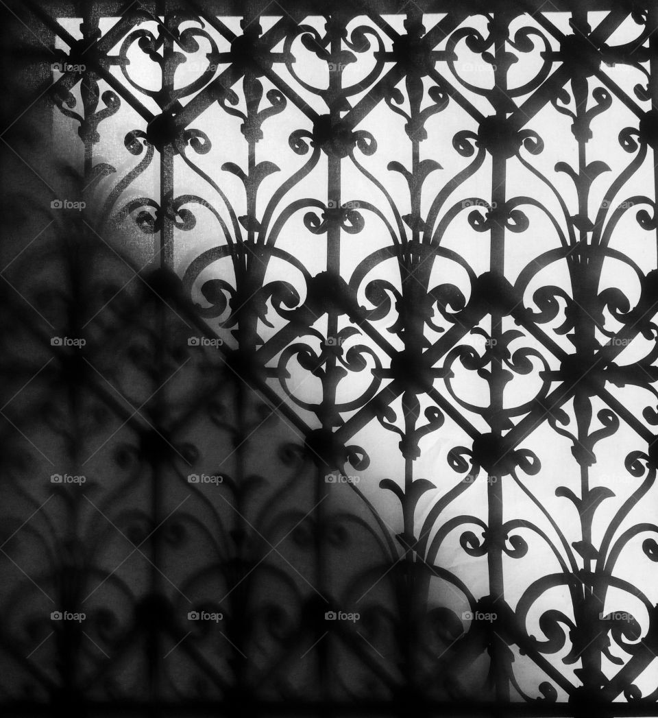 Cast iron window grid with black and white contrast