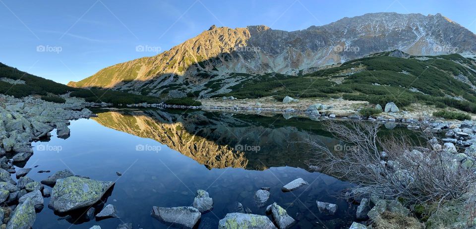 Mountains mirroring in a lake