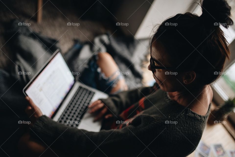 young girl student doing assignment on campus