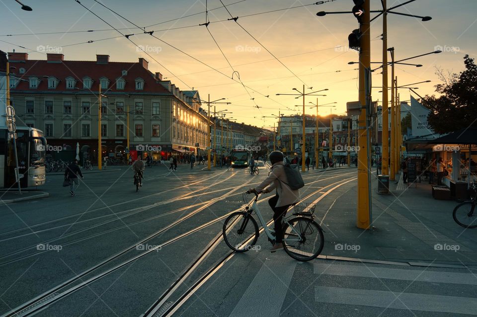 Person on a bike at sunset