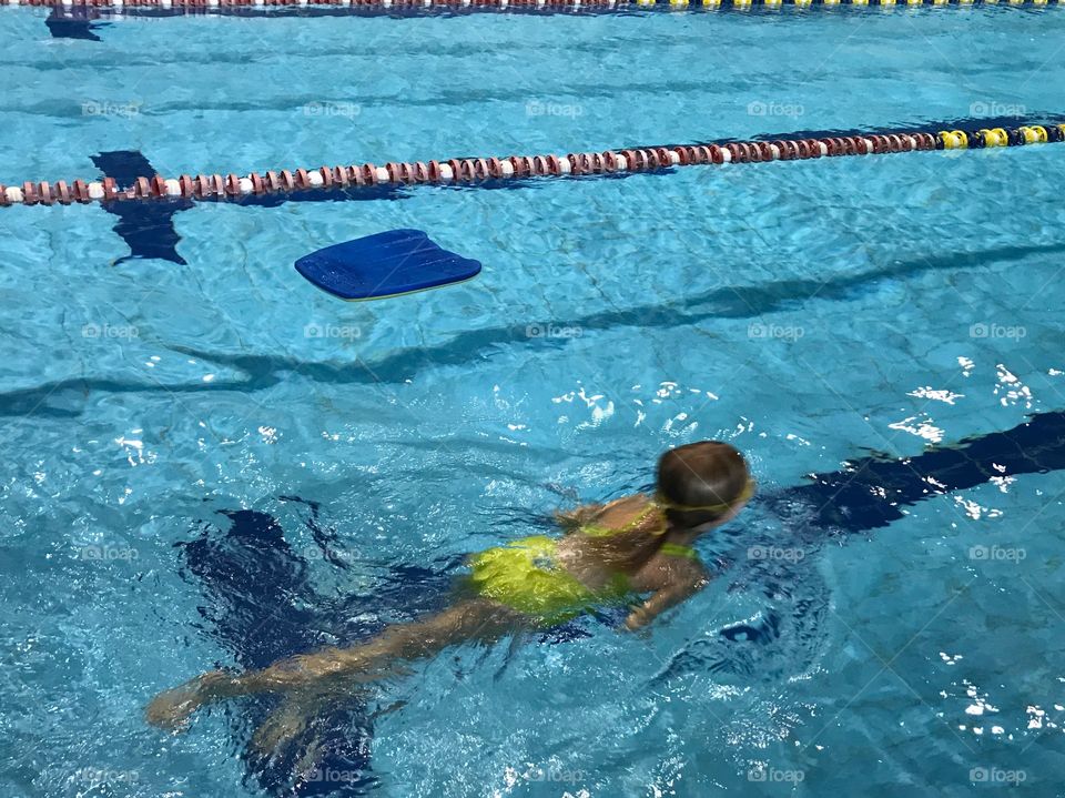 A girl swimming in the pool