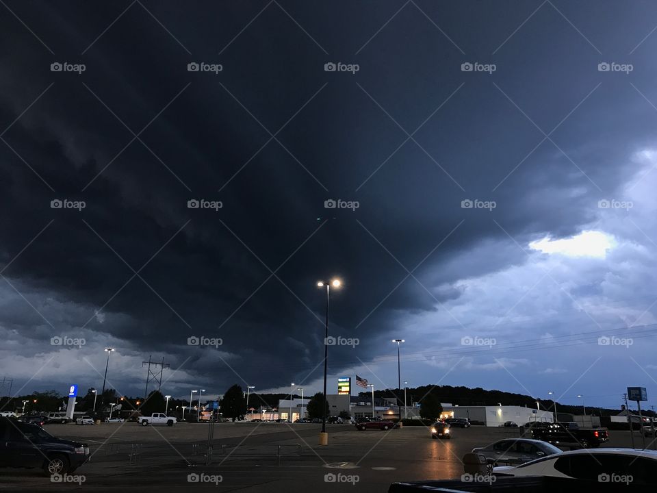 Dark thunder clouds in a city