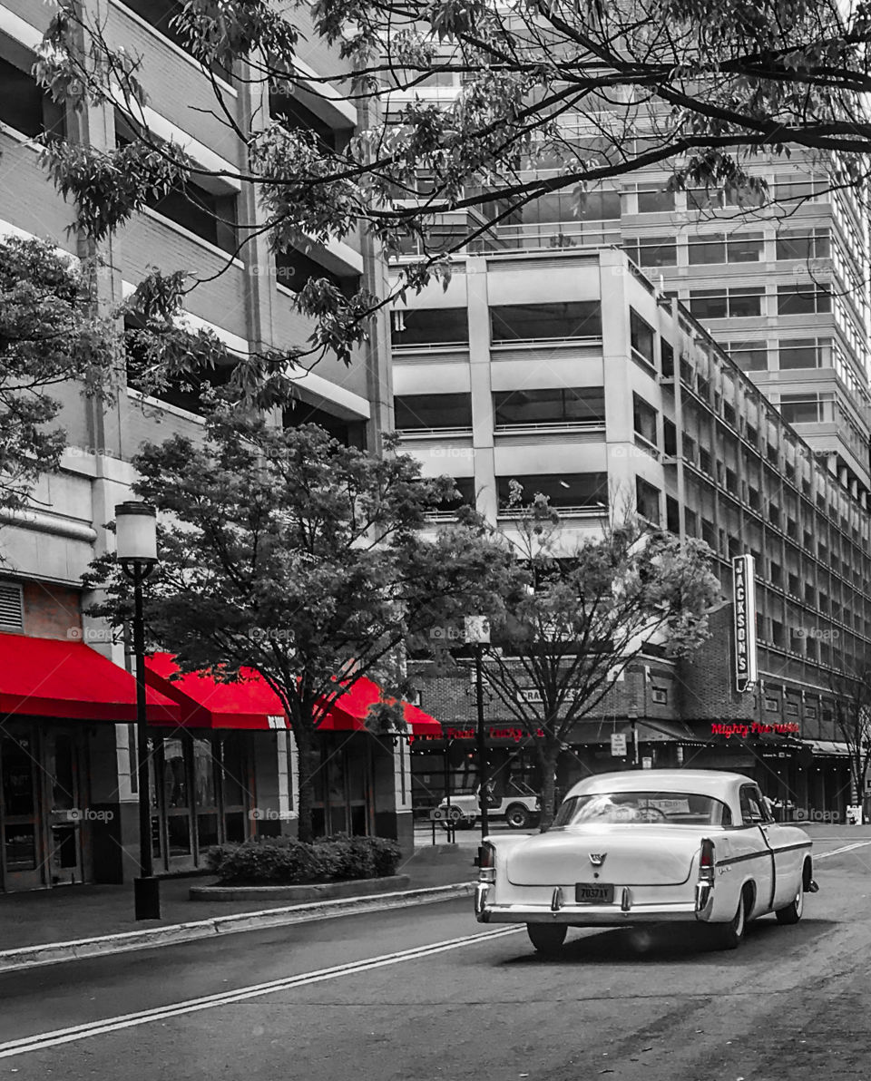 Vintage car cruising on an empty street 