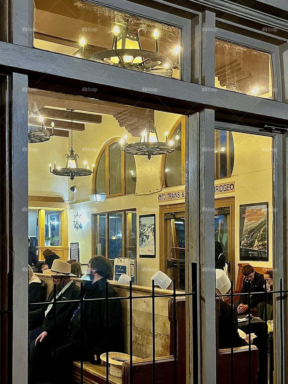 People in Train Station Lobby Windows