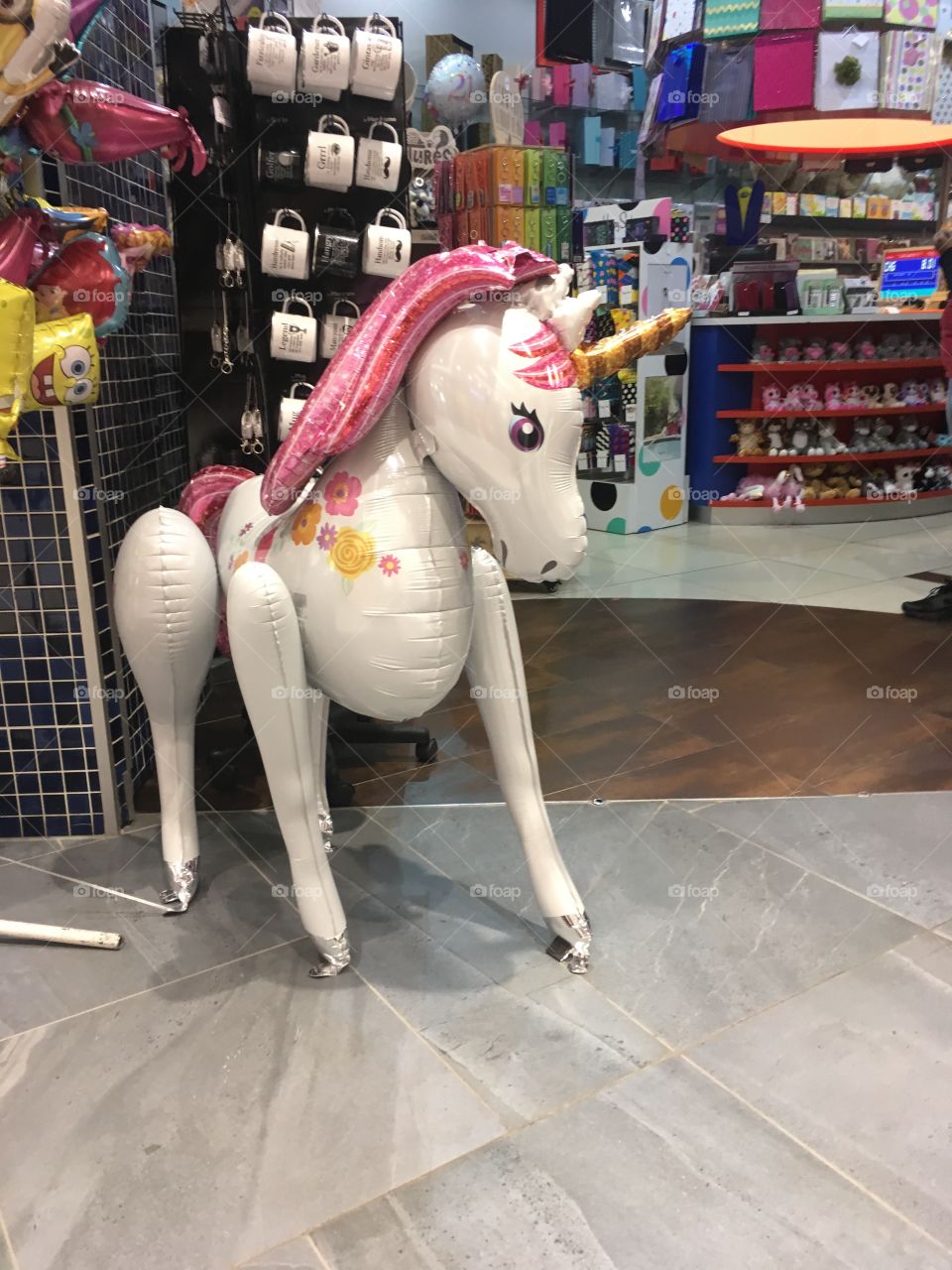 Unicorn ballon at shop entrance