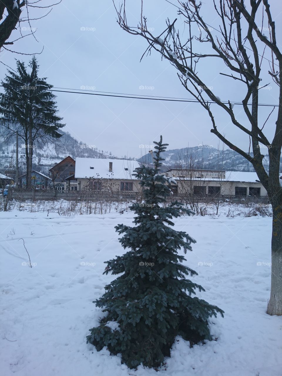 village in the mountains in winter season