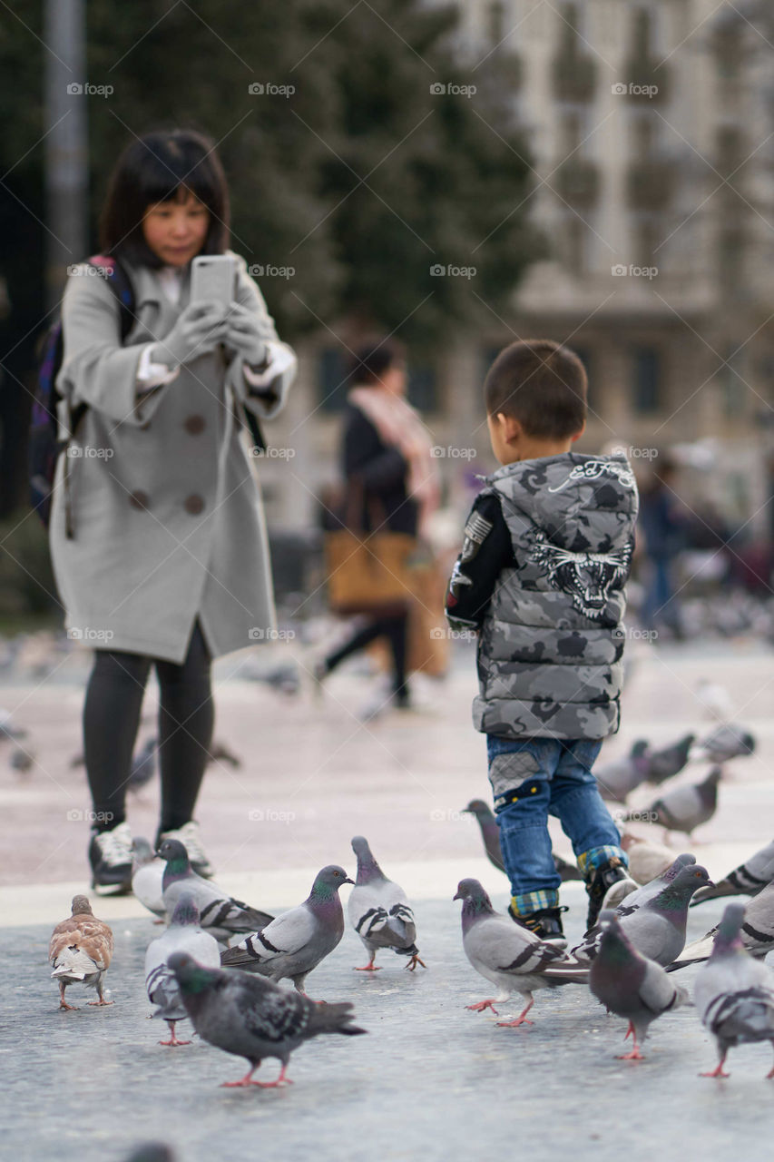 Mother, Son and Pigeons 