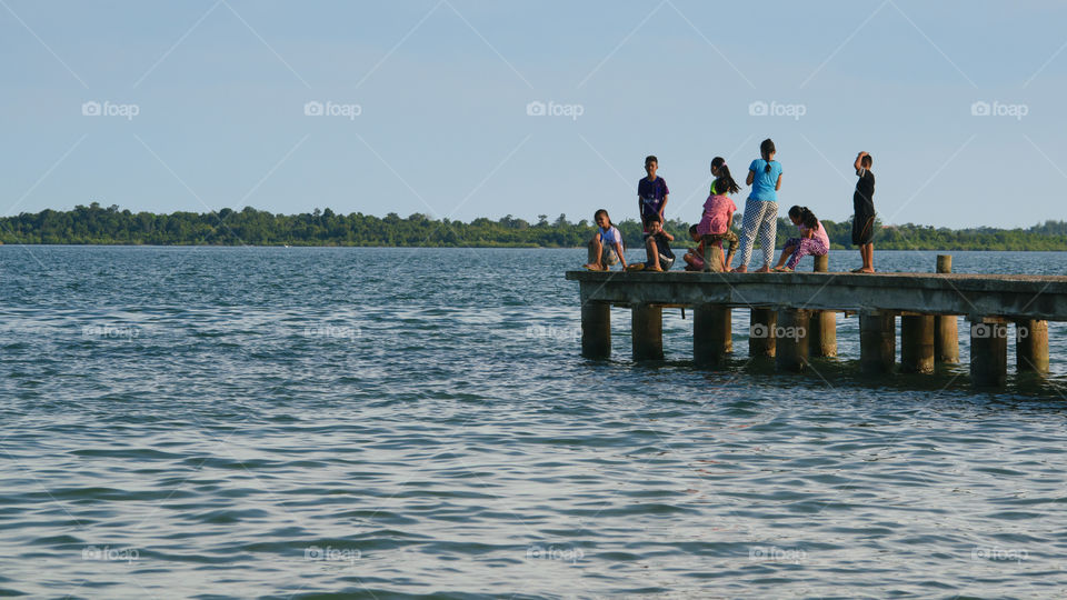 Children and landscape view from the beach