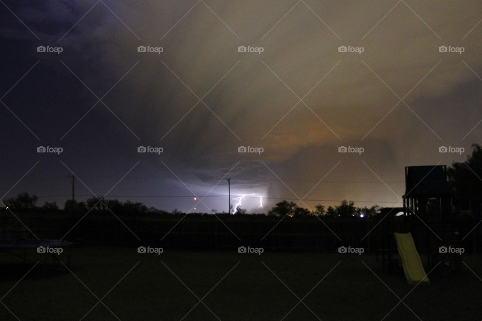 Wild weather. Storm clouds at night with lightning