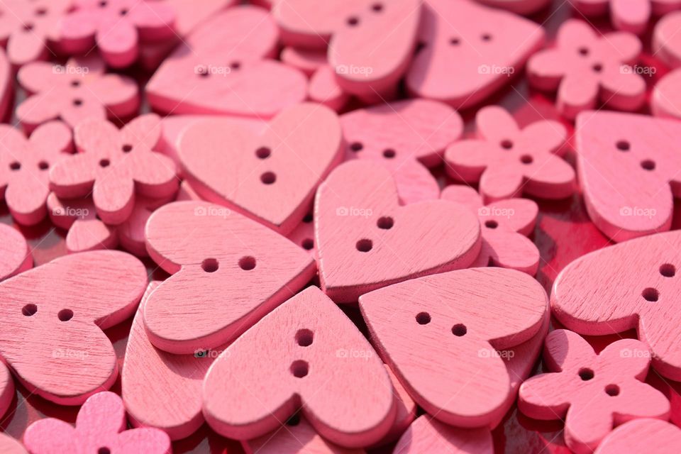 magenta colour wooden hearts buttons beautiful texture abstract background
