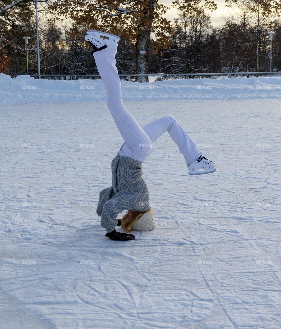 Young girl making dance moves at the ice ,a winter day in norway .