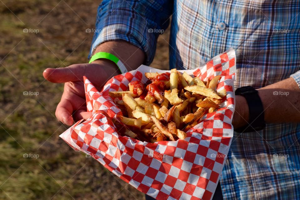 Close-up of a person holding fried food