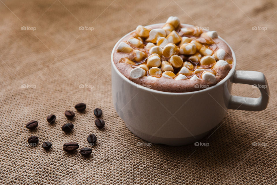 Close-up of coffee cup with marshmallow