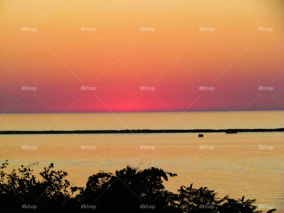 Sunset over breakwall
