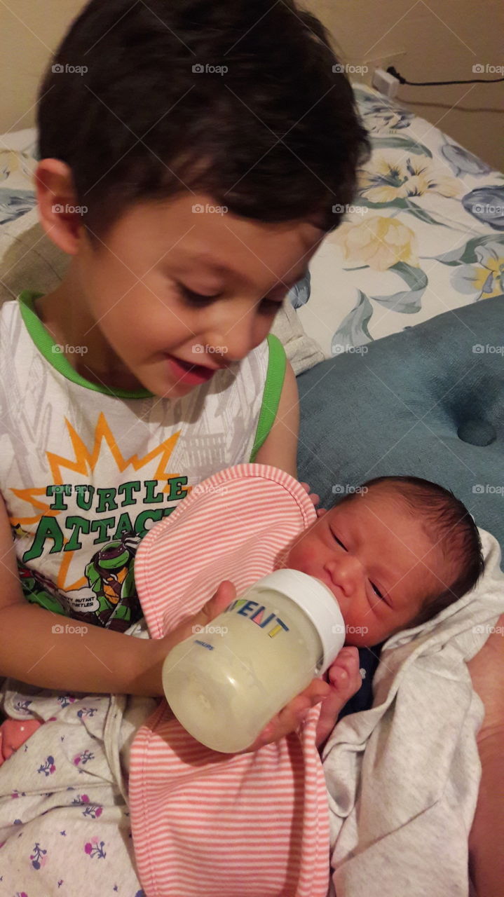 My little boy taking care of his sister! He love her