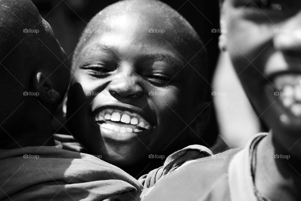 Young African boy laughing