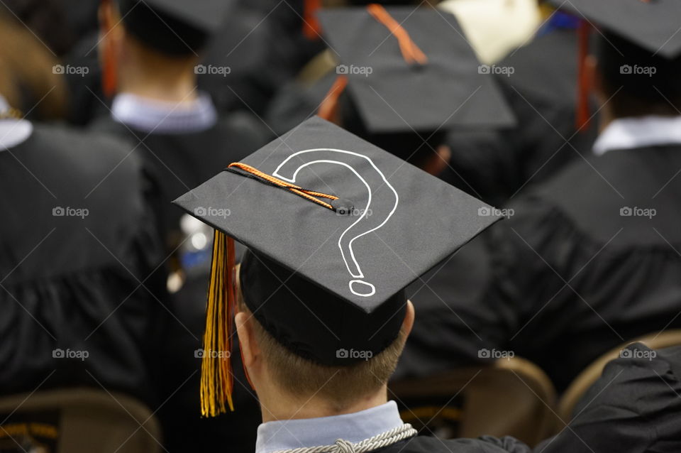 Rear view of graduates in caps and gowns