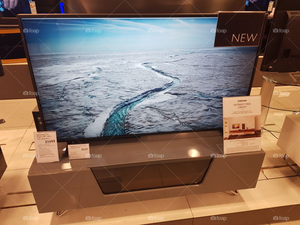 Samsung The Frame 4K UHD television installation on TV stand at Peter Jones Sloane square Chelsea King's road London displaying nature artwork