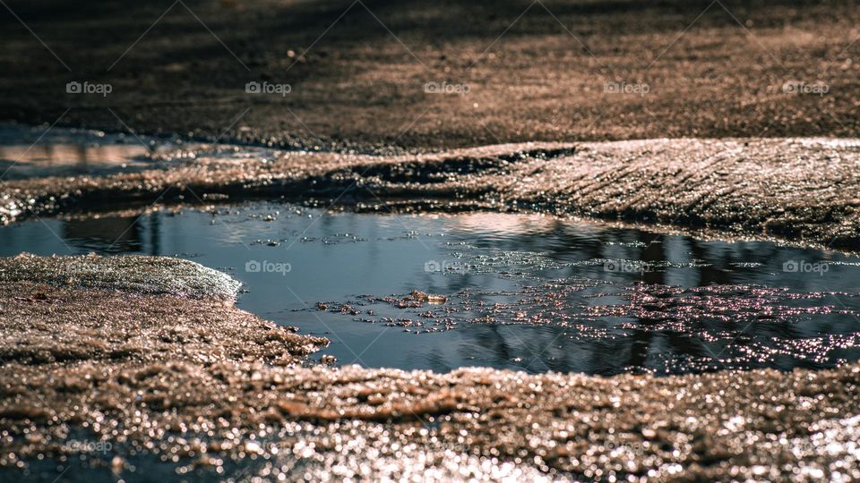 Puddle in the street macro.