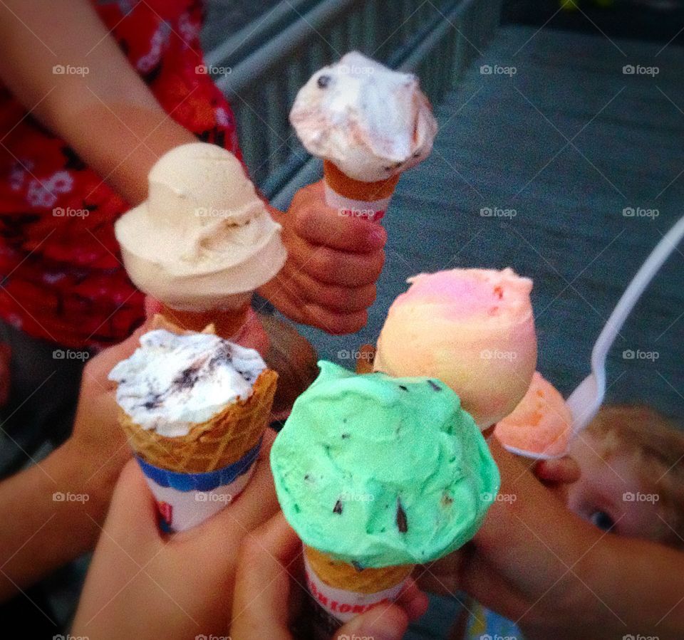 Cheers! . Love my niece's little face looking up, holding her cup of ice cream - holding ice cream mission