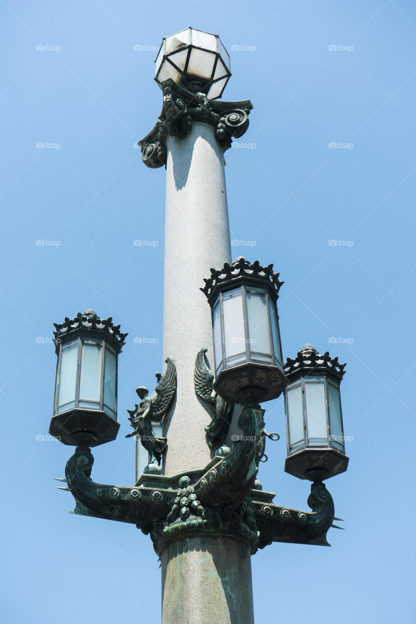 Ancient unlit lamppost in the center of Barcelona.