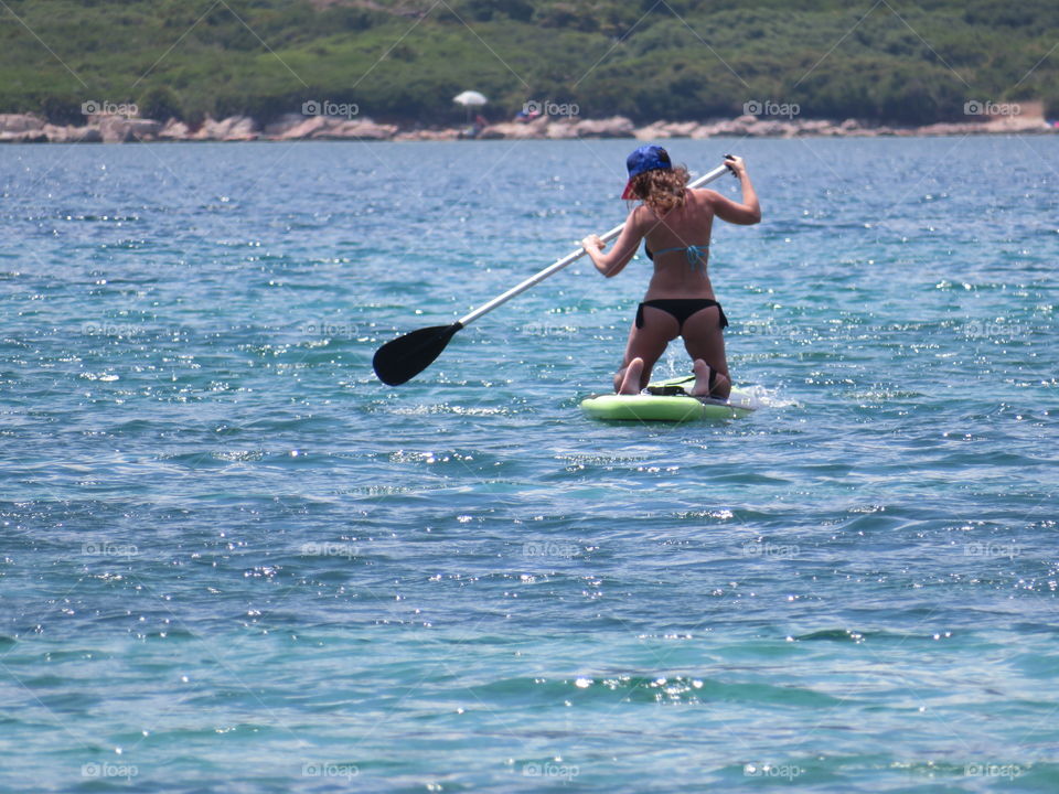 summer girl activity stand up paddle