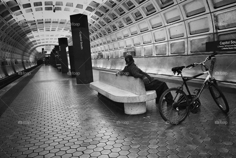 Cyclist waiting for subway in Washington DC station 