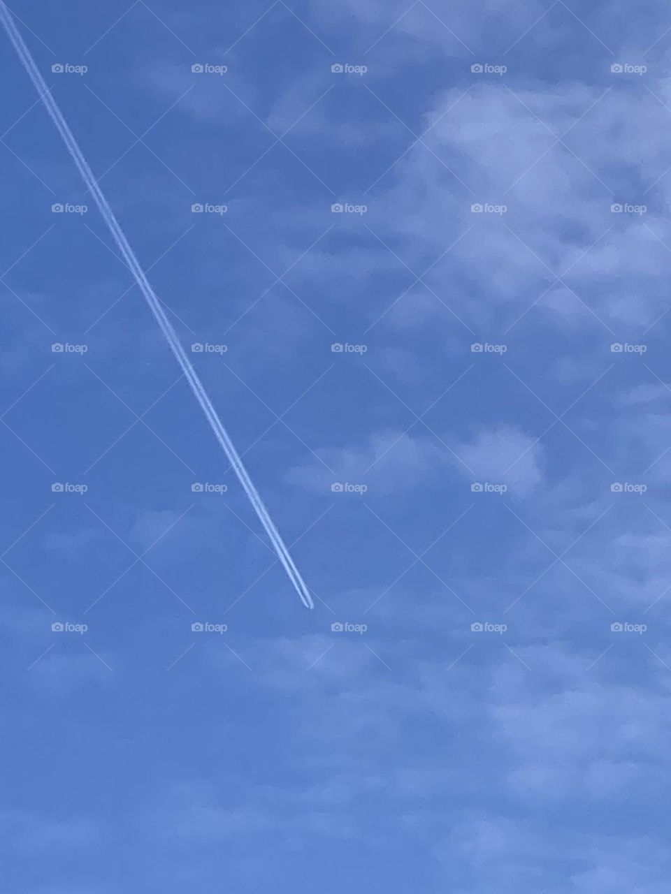 “Water vapor trail from plane”