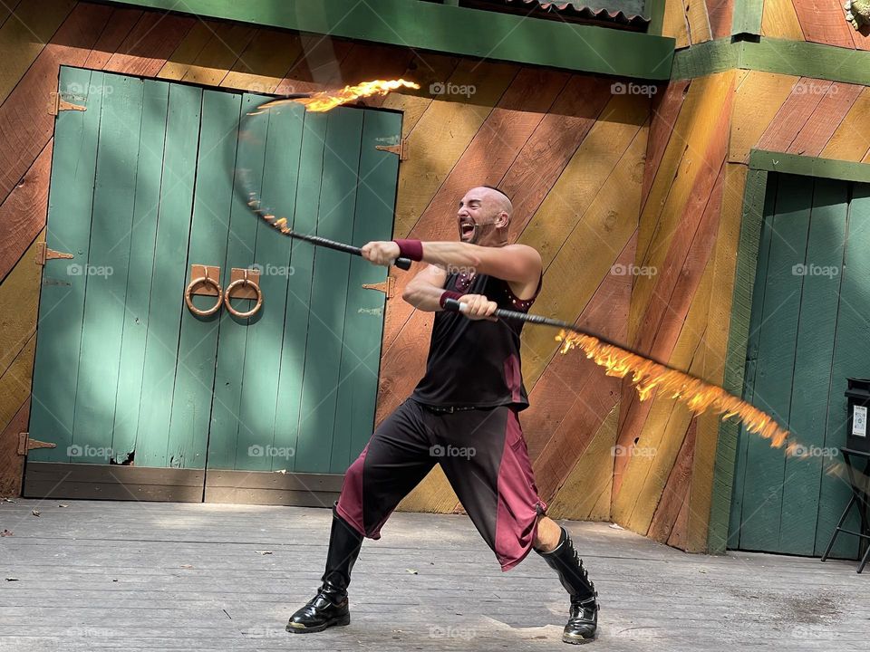 Performer and his fire whip 