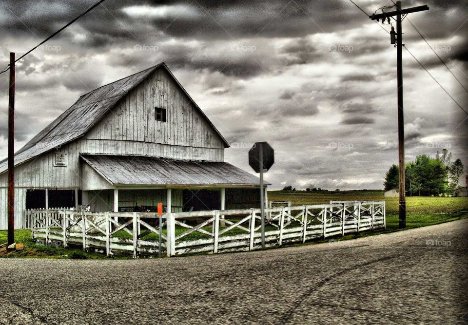 Proper HDR photo of farm and crossroads before storm