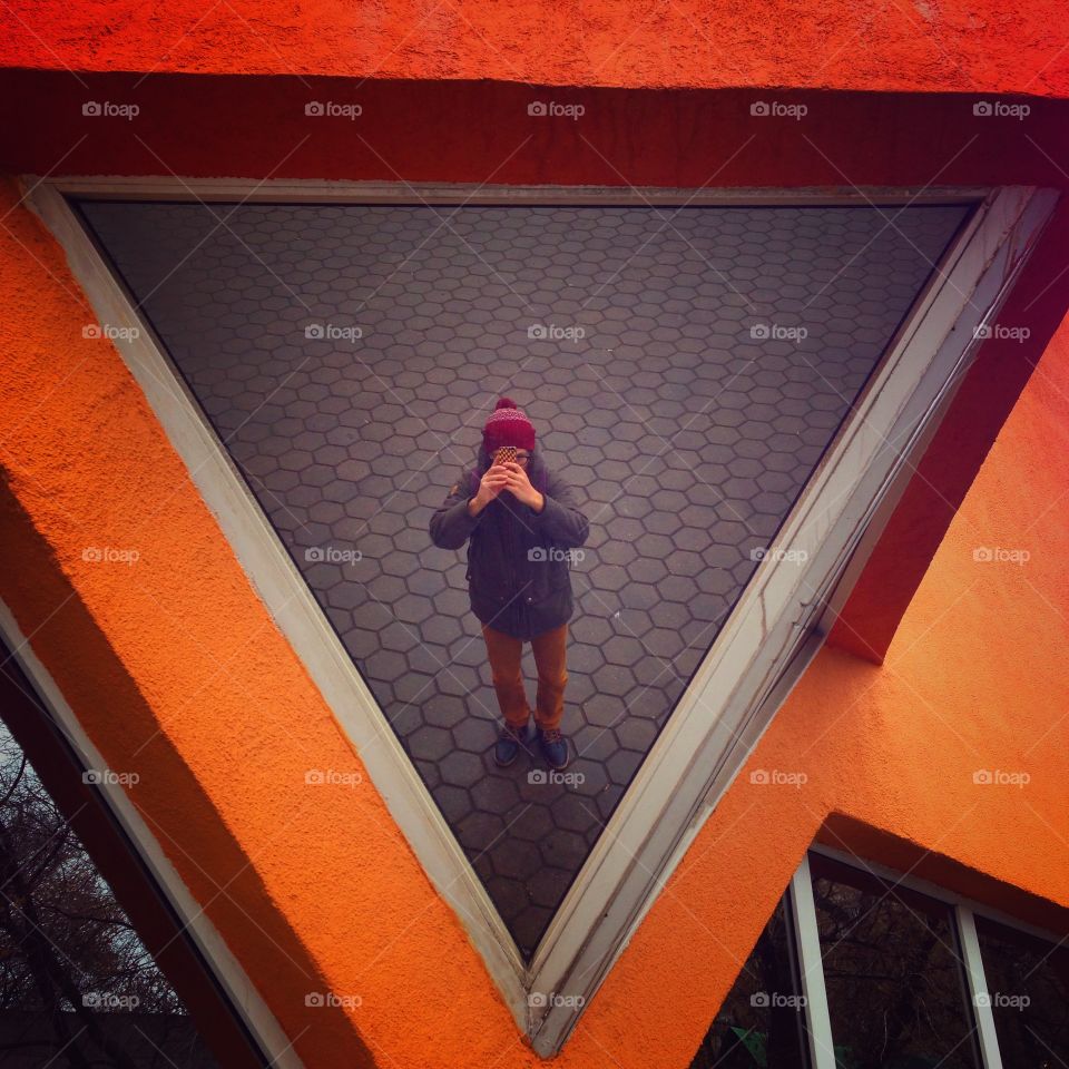 Reflection of me in a triangle window