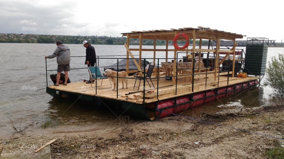 building a raft on the river bank