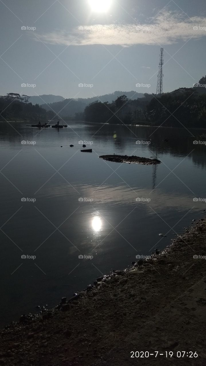 the sun over the river