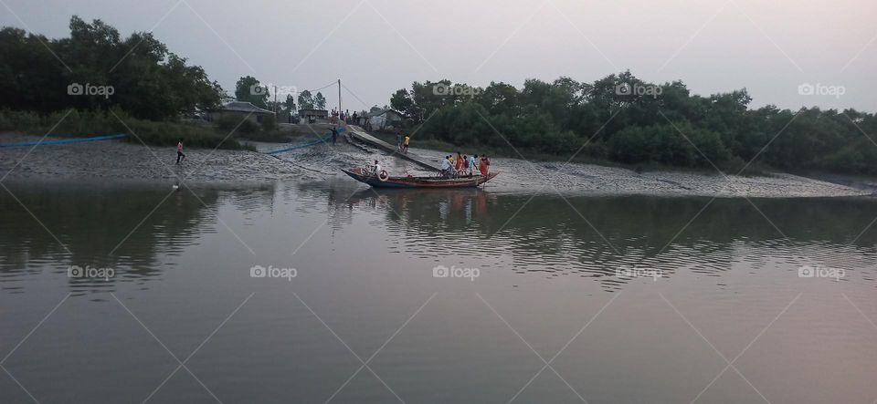 People crossing the river in Sundarbans