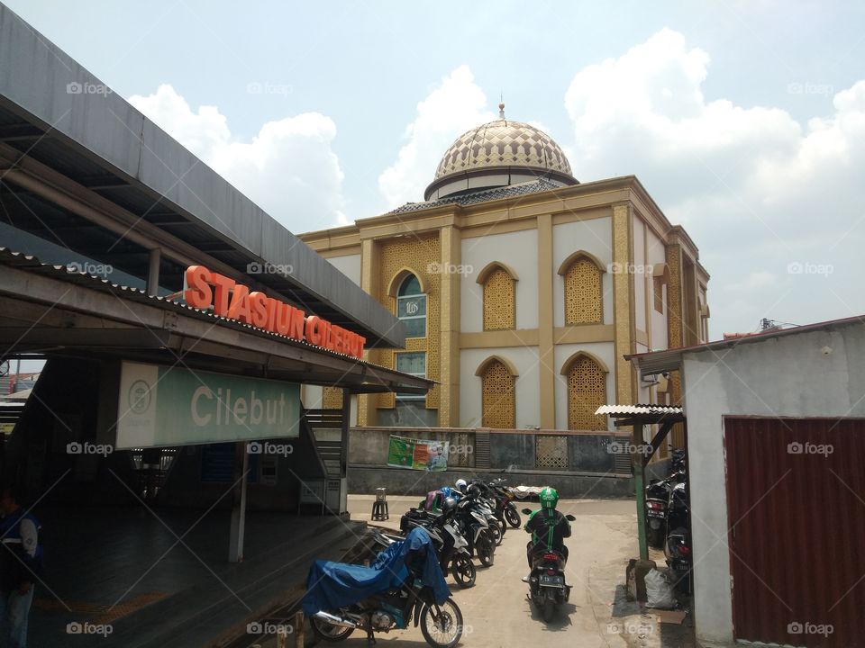 a mosque beside the train statin